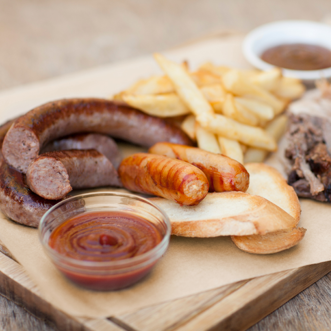 sausages and fries on greaseproof paper